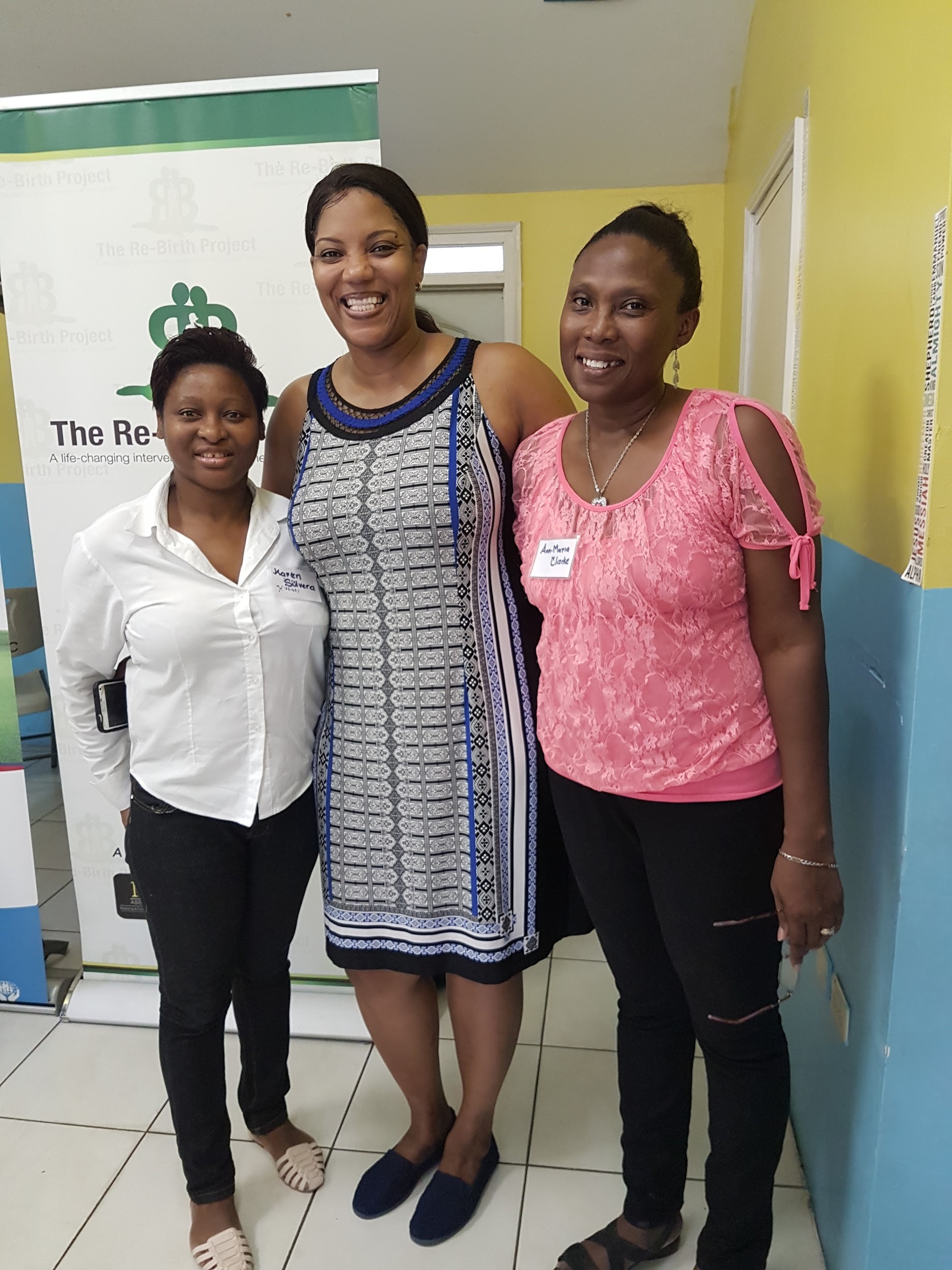 Karen Silvera (right) and Ann-Maria Deans-Clarke (left), of First Heritage Co-Operative Credit Union (FHC) and volunteers with The Re-Birth Project, share lens
