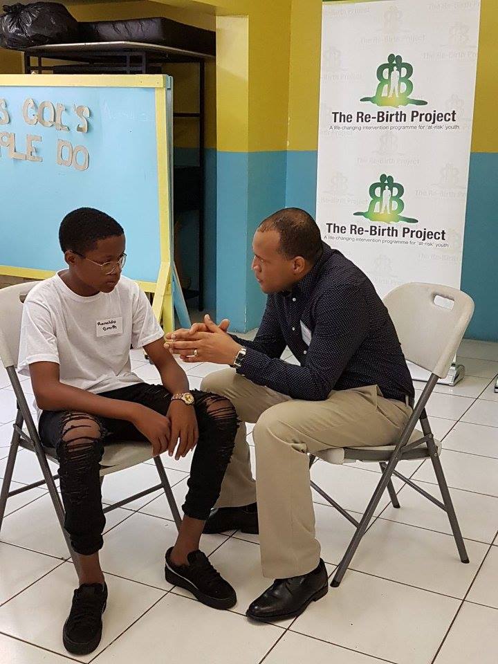 Rohan Ambersley, CEO, Massy Gas Products, speaks candidly with Ronaldo Smith, a student participant from The Re-Birth Project after his motivational presentation during Phase 4 of the project at the Webster Memorial Church.